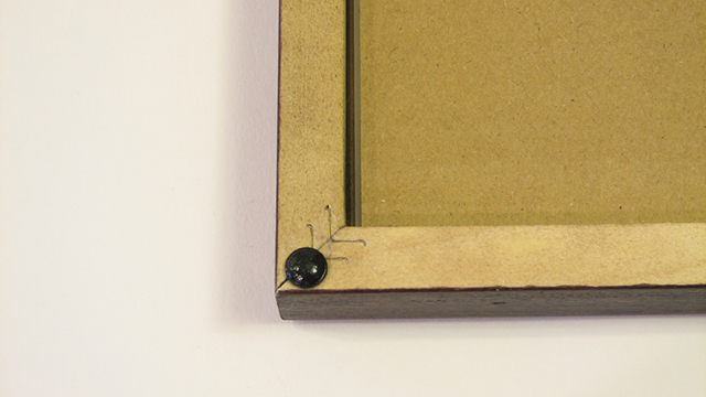Use Rubber Feet To Keep Picture Frames Straight