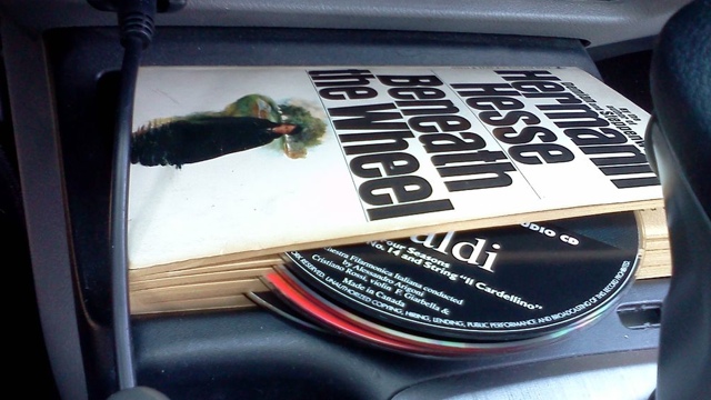 Hold Loose CDs In A Book For Easy Transportation