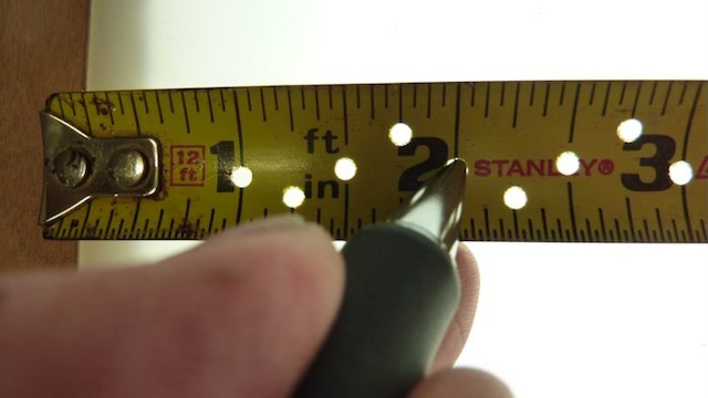 Make Measuring Small Distances Easy With A Hole Punched Tape Measure