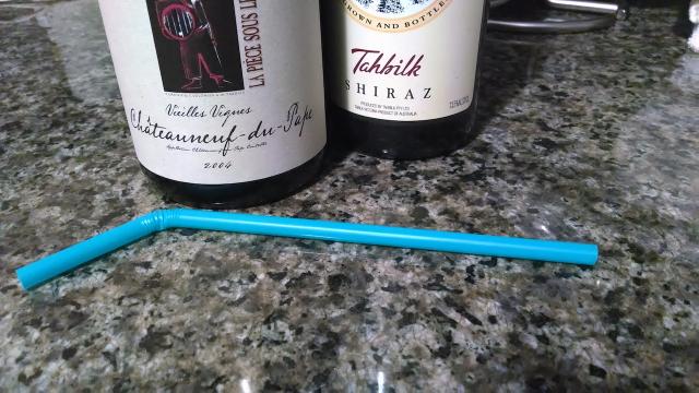 Use A Drinking Straw To Remove Cork Crumbs From A Wine Bottle