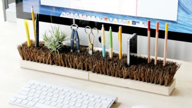 Invert Broom Heads To Organise Your Desk