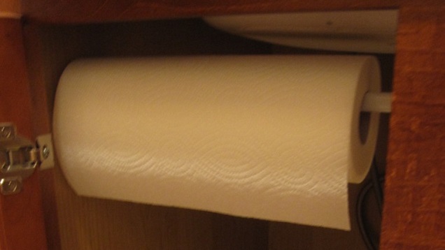 Use A Tension Rod For Hidden Paper Towel Storage