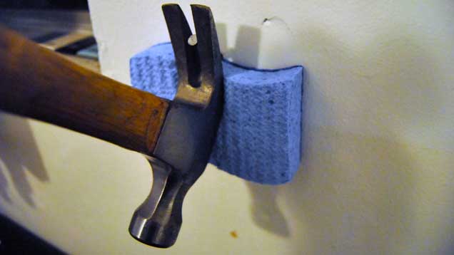Protect Your Wall With A Sponge When Pulling Nails