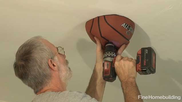 Catch Debris With A Basketball When Drilling Into The Ceiling
