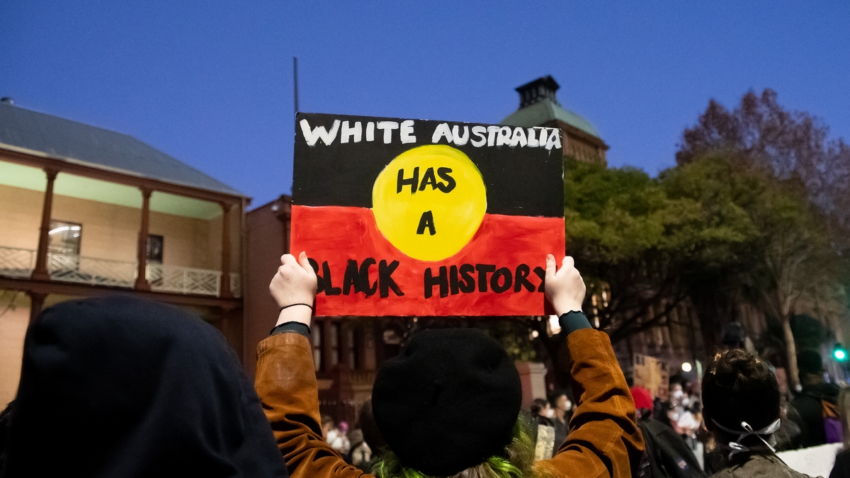 SYDNEY, AUSTRALIA - JUNE 02: Protesters hold up signs at Parliament House during a 'Black Lives Matter' rally on 02 June, 2020 in Sydney, Australia. This event was organized to rally against aboriginal deaths in custody in Australia as well as in unity with protests across the United States following the killing of an unarmed black man George Floyd at the hands of a police officer in Minneapolis, Minnesota. (Photo by Speed Media/Icon Sportswire)