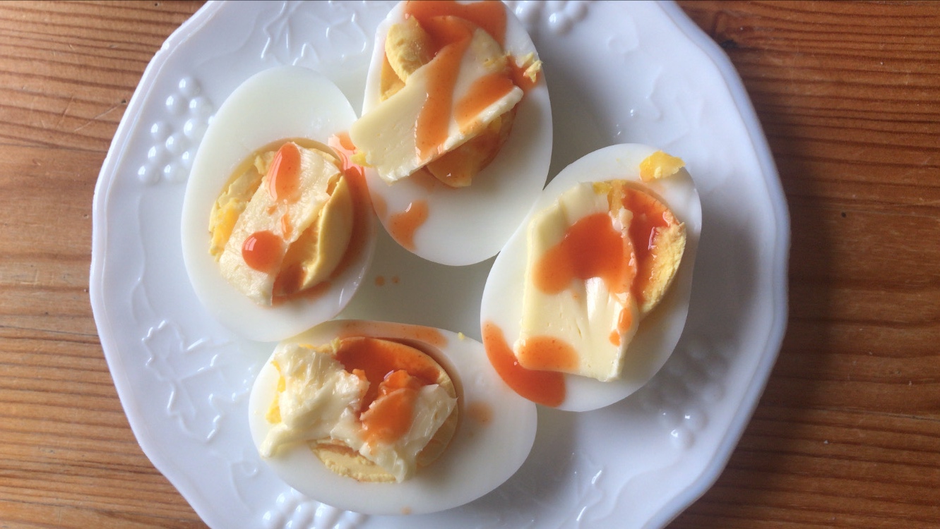 Hard-boiled eggs with butter and hot sauce is a top-tier breakfast. (Photo: Claire Lower)