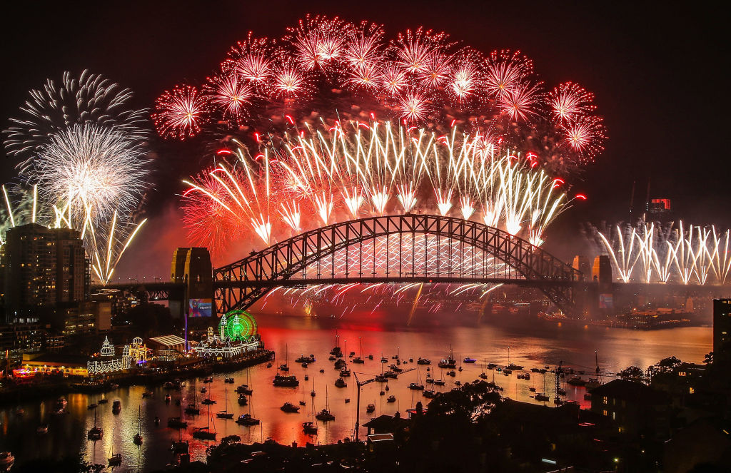 SYDNEY, AUSTRALIA - JANUARY 01: Fireworks explode over the Sydney Harbour Bridge during the midnight display on New Year's Eve on Sydney Harbour on January 1, 2019 in Sydney, Australia. (Photo by Scott BarbourCity of Sydney/Getty Images)
