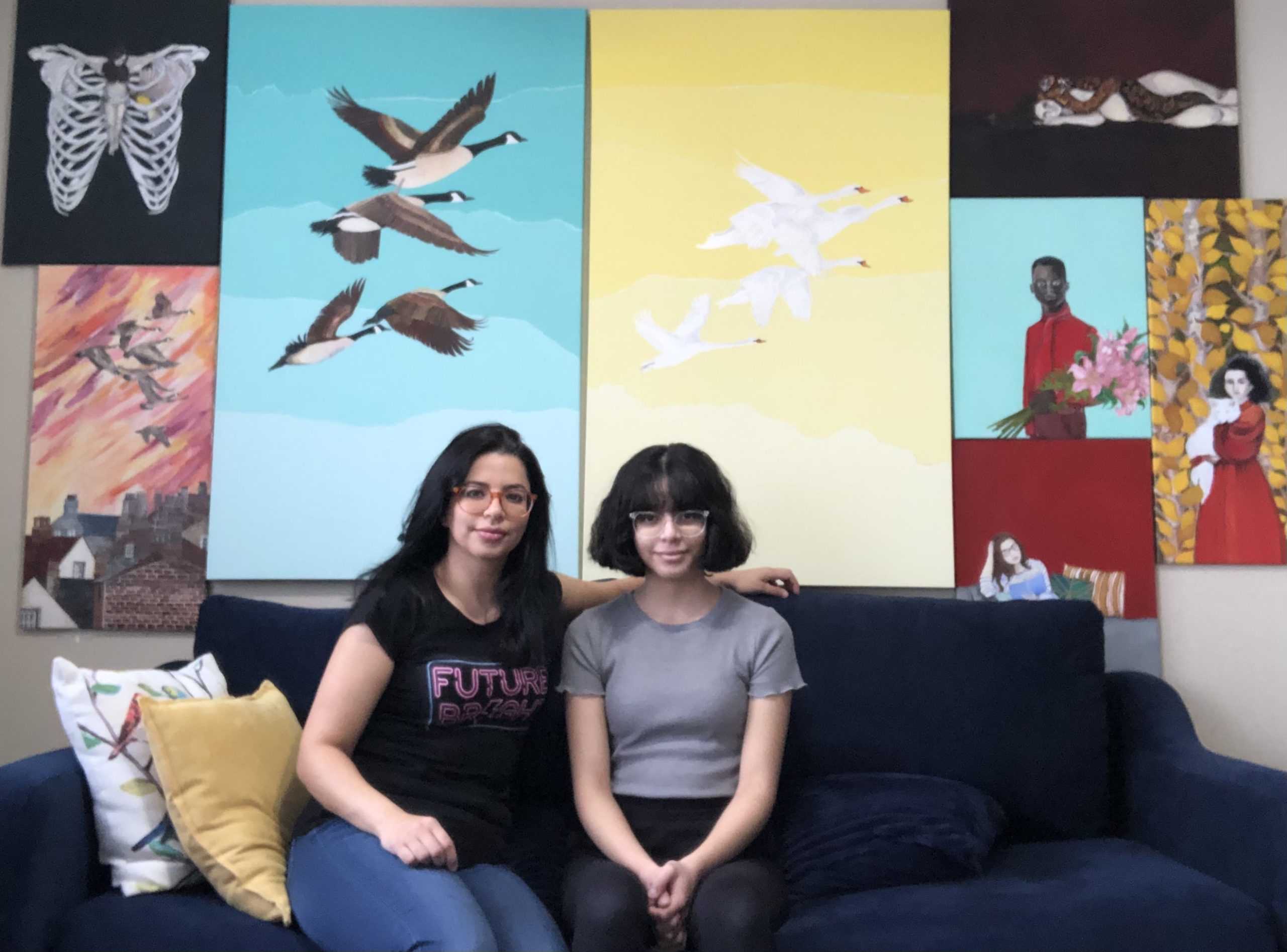 Fatima Matar (left) with her daughter, Jori, in their apartment in Ohio. Matar's artwork hangs behind them. (February, 2021) (Photo: Used with permission from Matar)