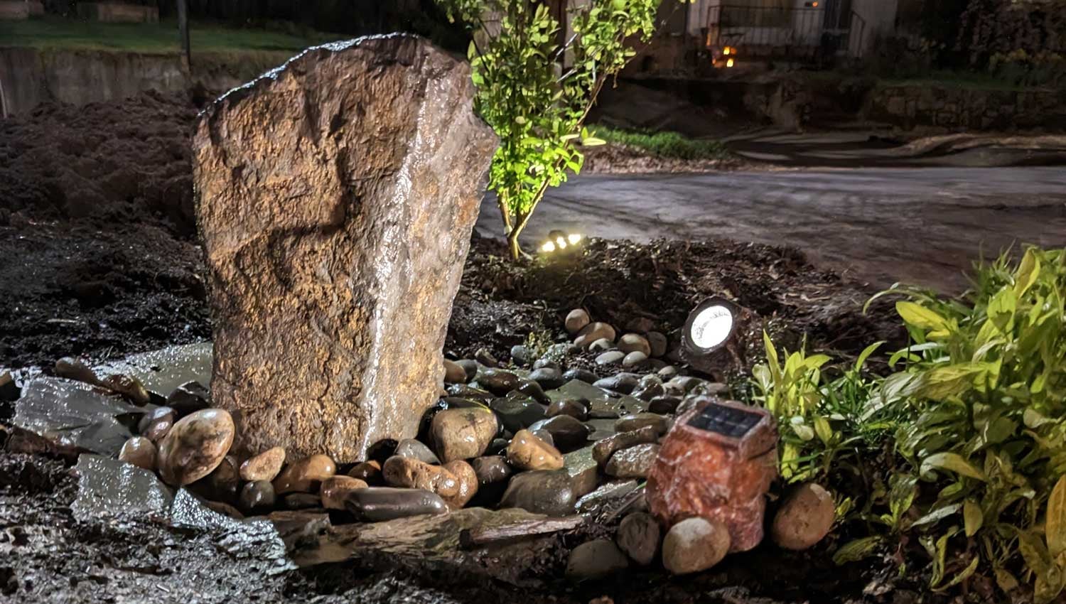 Solar lights disguised as rocks illuminate this feature at night, but blend in well.  (Photo: Amanda Blum)