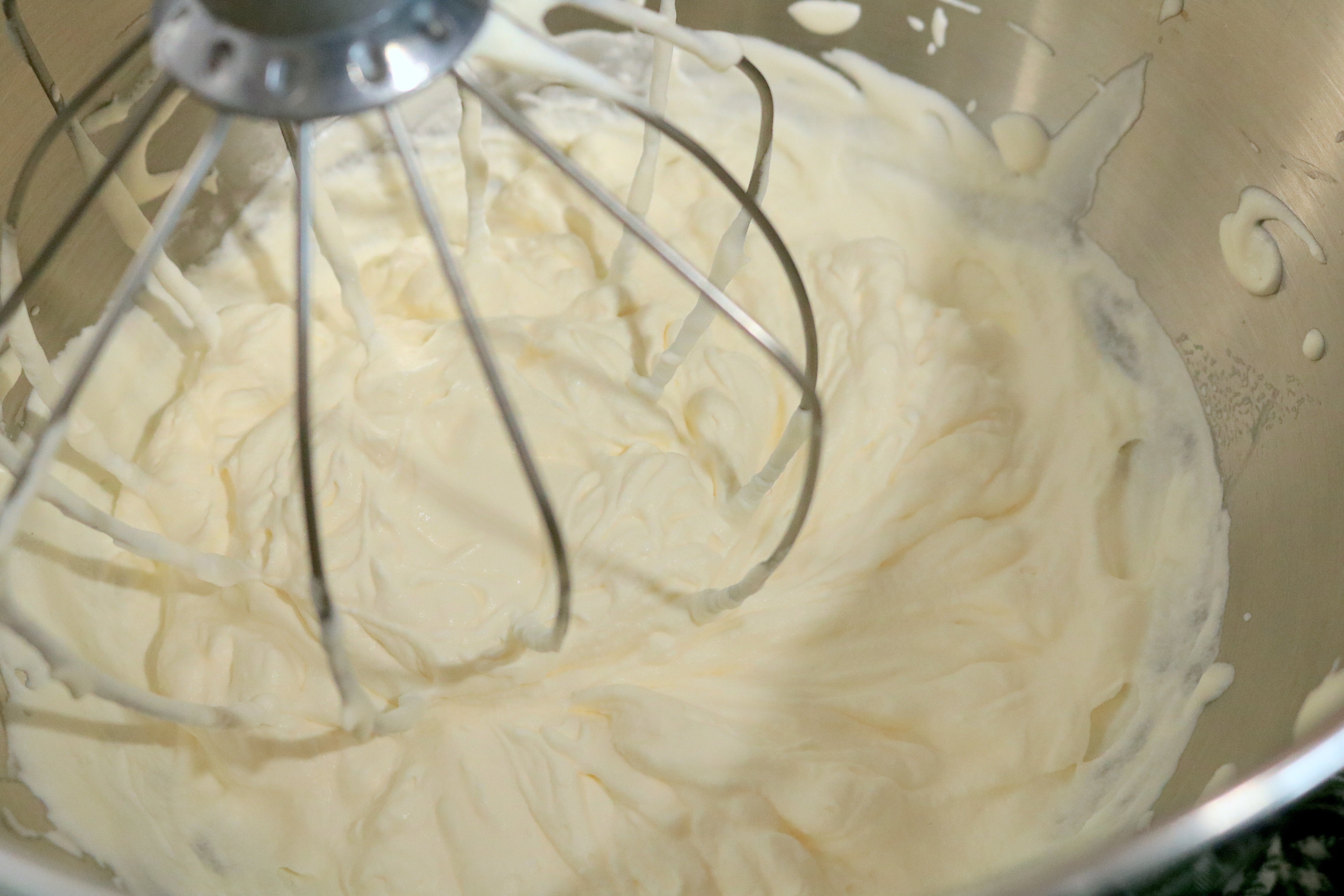 What stiff peak whipped cream looks like while whisking. (Photo: Allie Chanthorn Reinmann)