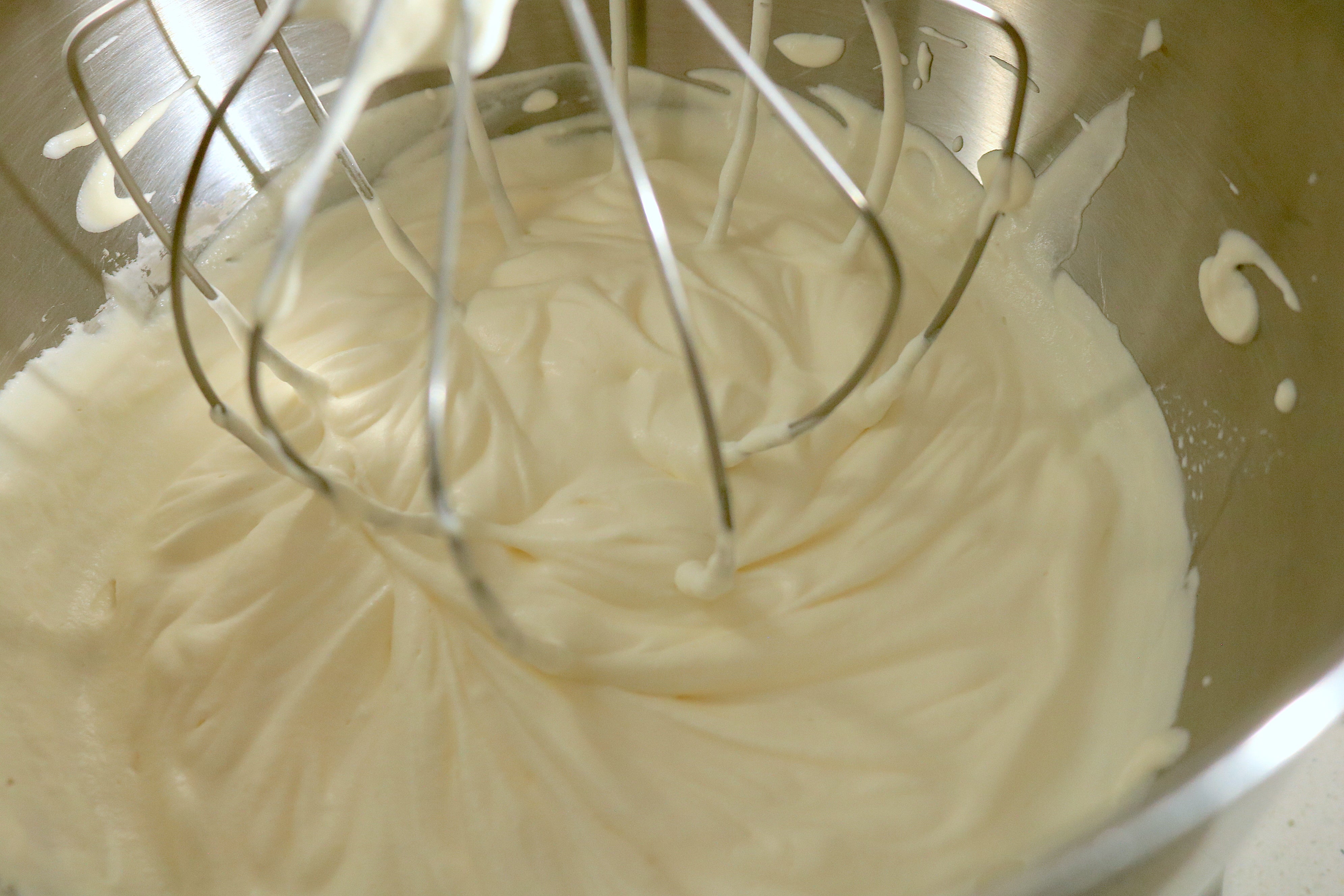 What medium peak whipped cream looks like while whisking. (Photo: Allie Chanthorn Reinmann)
