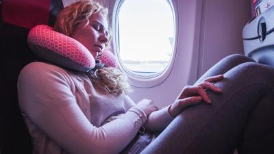 How on Earth Do You Fall Asleep on a Plane? Here’s What Experts Recommend