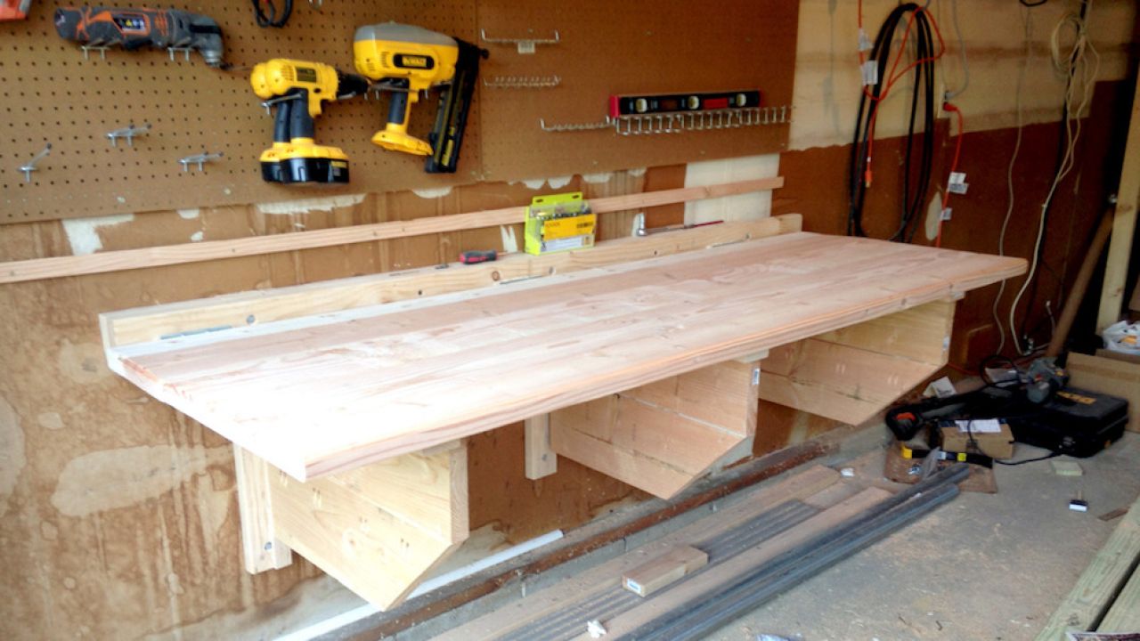 This DIY Floating Workbench Folds Into Place When It’s Time To Work, Away When You’re Done