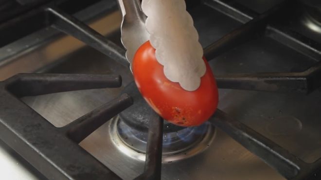 Quickly Peel Tomatoes By Torching Them On A Gas Stovetop