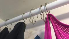 Put A Curtain Rod Inside Your Shower To Dry Your Clothes