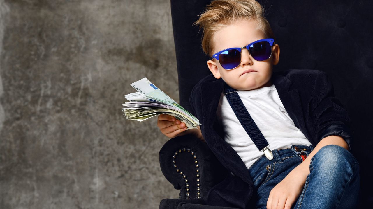 An Age-By-Age Guide to Teaching Kids About Money