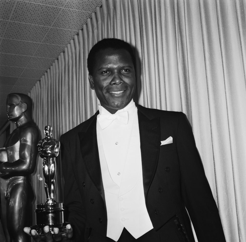 Bahamian-American actor Sidney Poitier at the 39th Academy Awards in Santa Monica, Los Angeles, 10th April 1967. He is presenting the Oscar for Best Supporting Actress.