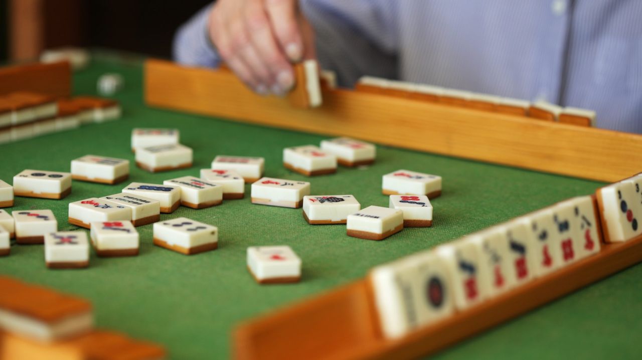 Wooden racks are used to display your tiles while playing mahjong